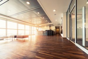 Office reception with wood floors and window wall